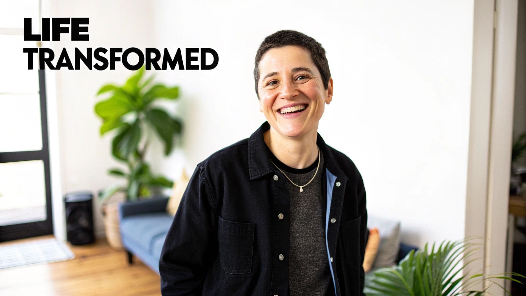 A happy person with short hair in a black jacket smiling, with 'LIFE TRANSFORMED' text.